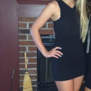 Black bodycon dress with zipper detail on back